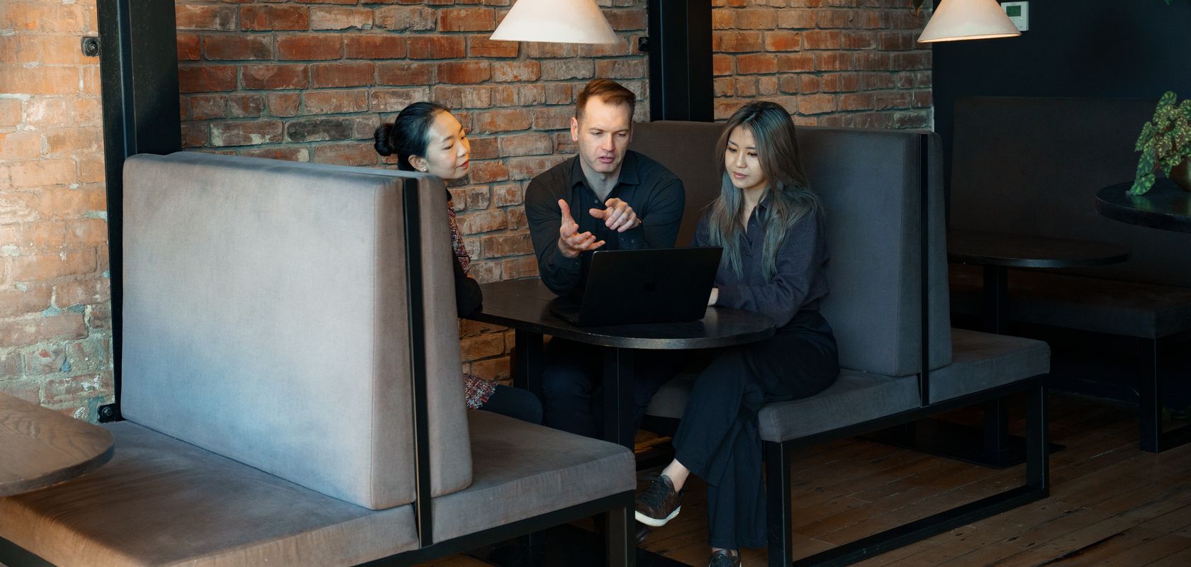 Addison, Francisca and Yumeng in a client meeting at the 4D office